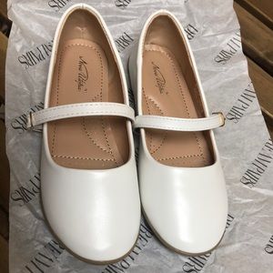 Little girls white dress shoes.